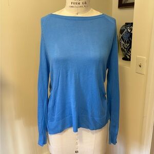 Silky cotton blue long sleeve top with boat neck and ribbed hem